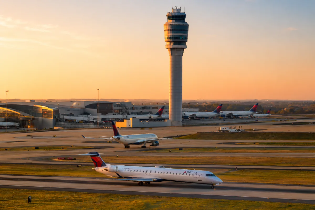 Regional turboprop and regional jet on an airport runway at dawn